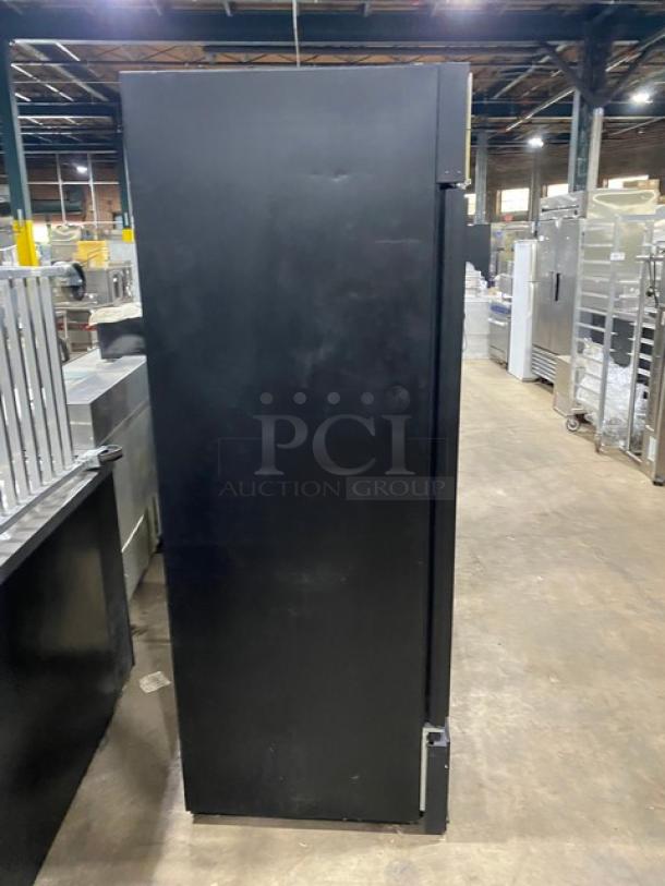 True GDM-49F commercial black double glass swing door freezer, poly-coated wired rack, excellent condition.