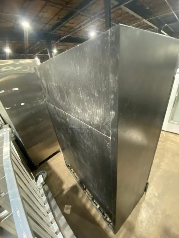 True GDM-49F commercial freezer, black, double glass swing doors, poly-coated rack, 115/208-230V, 1-phase, visible wear.
