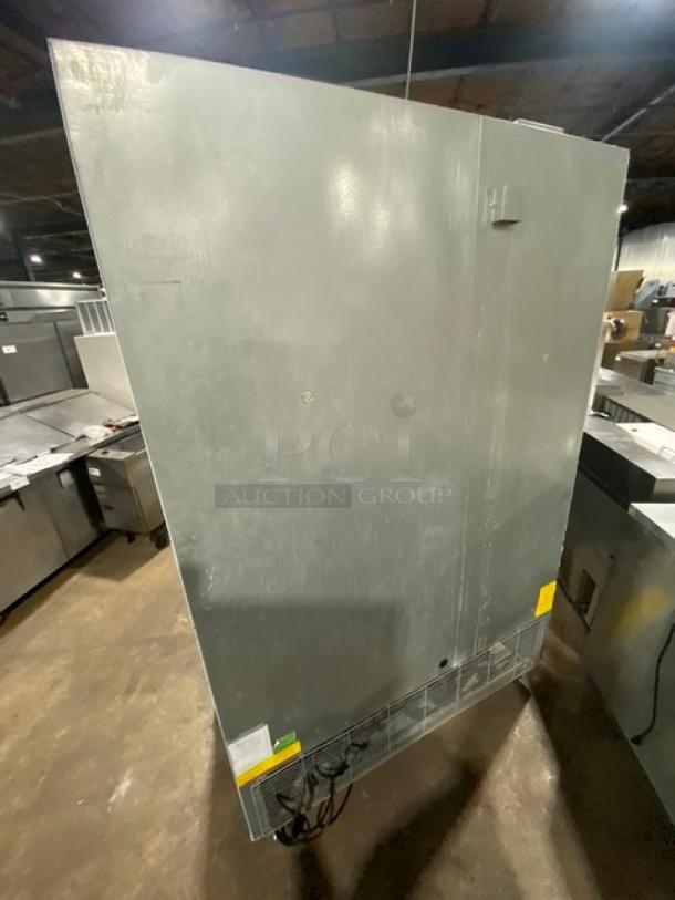 Asber 2022 ARF49HFHC commercial stainless steel double swing door reach-in freezer with poly-coated wired rack, on casters.