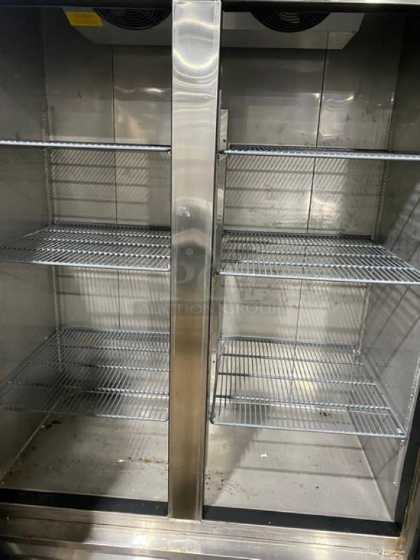Asber 2022 commercial stainless steel double swing door freezer, Model ARF-49-HF-HC, with poly-coated wire racks, on casters.
