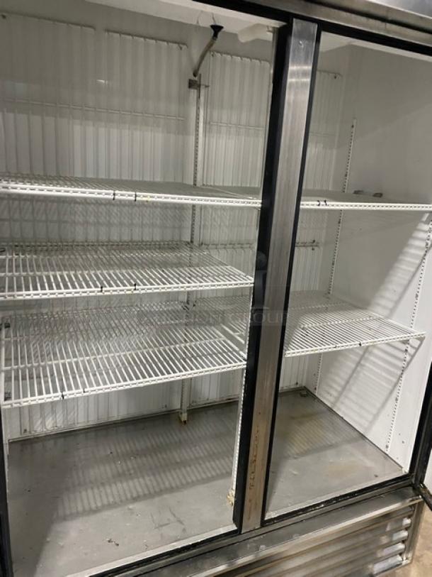 True Commercial Stainless Steel 2-Door Reach-In Freezer, Model T-49F, with poly-coated wire racks, on casters.