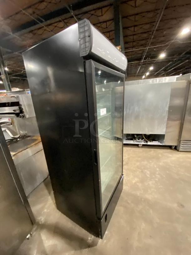 Ojeda FMH27 commercial glass door refrigerator, black finish, poly-coated wire rack, single swing door, used condition.