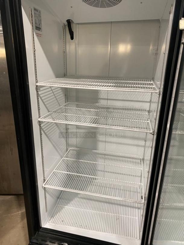 Ojeda FMH-27 commercial glass swing door refrigerator, poly-coated wired rack, Model FMH-27, clean condition.