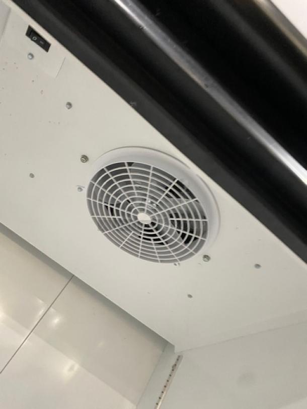 Ojeda FMH27 commercial refrigerator fan and interior view. Features poly-coated wired rack, SN: 0013130-32488-D, 120V 1 Phase.