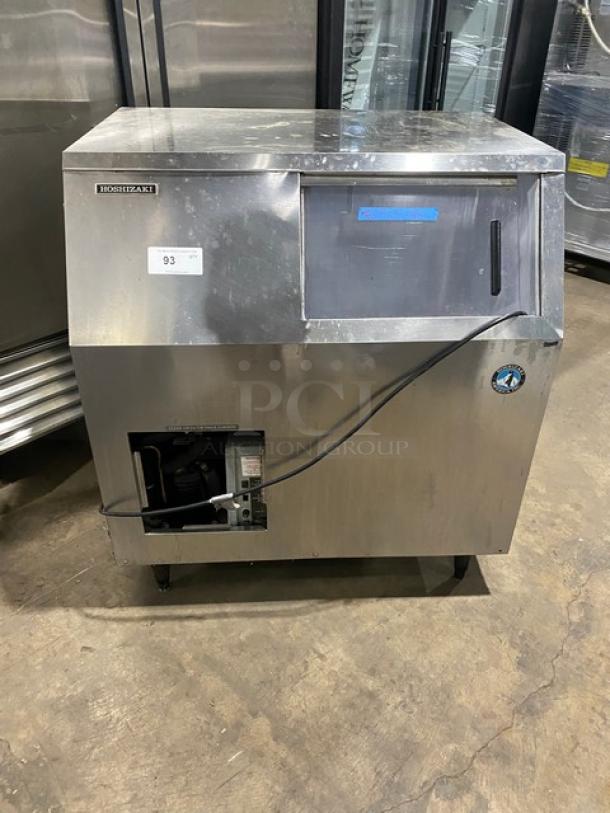 Hoshizaki stainless steel undercounter ice maker/bin combo with sliding access door, on legs, electric powered.