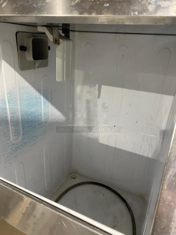 Hoshizaki undercounter ice maker/bin combo, stainless steel, sliding access door, on legs, interior view, clean condition.