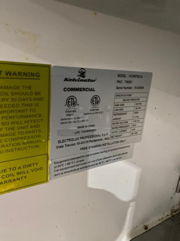 Kelvinator Commercial Stainless Steel 2 Door Refrigerated Bain Marie Prep Table, Model KCHMT60.24, SN 01420008, 115V, on casters; manufacturer label visible.