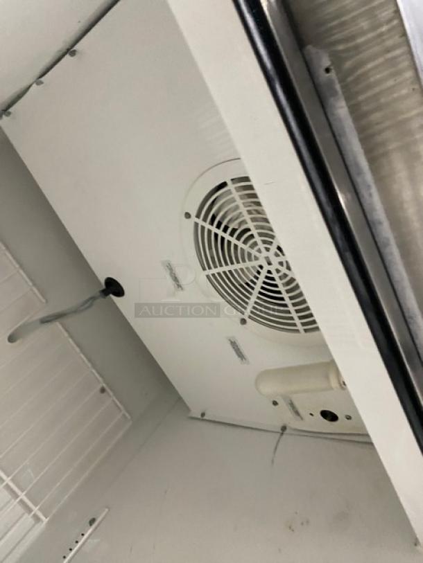True T-23F commercial stainless steel single door freezer interior view, Energy Star certified, with poly coated wire rack, on casters.