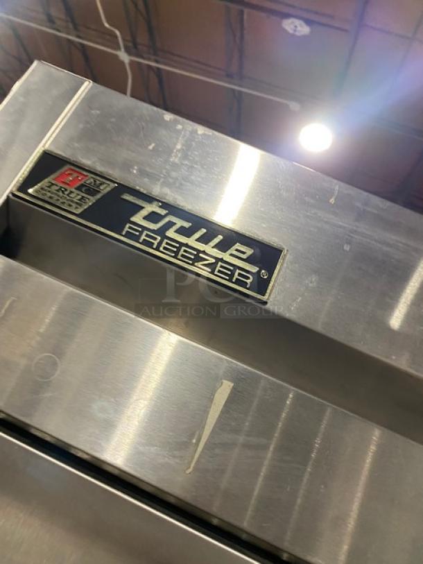True T-23F stainless steel single door reach-in freezer, Energy Star certified, with poly-coated wire rack on casters.