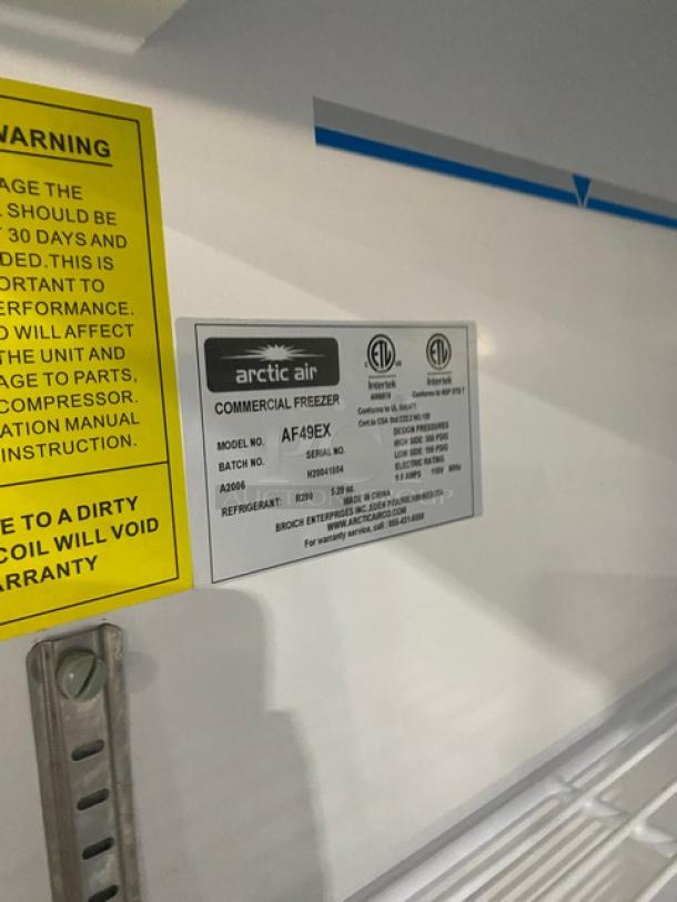 Arctic Air AF49EX commercial freezer label showing model and serial number. Includes safety warnings and specifications.