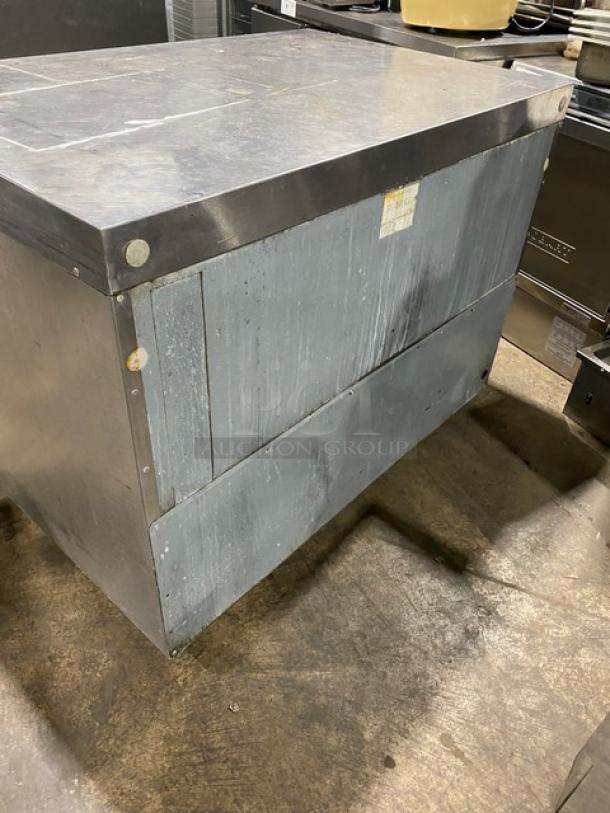 Delfield 4448 stainless steel 2-door undercounter refrigerator with flat top and wired rack. Serial number: 405434-T. 115V.