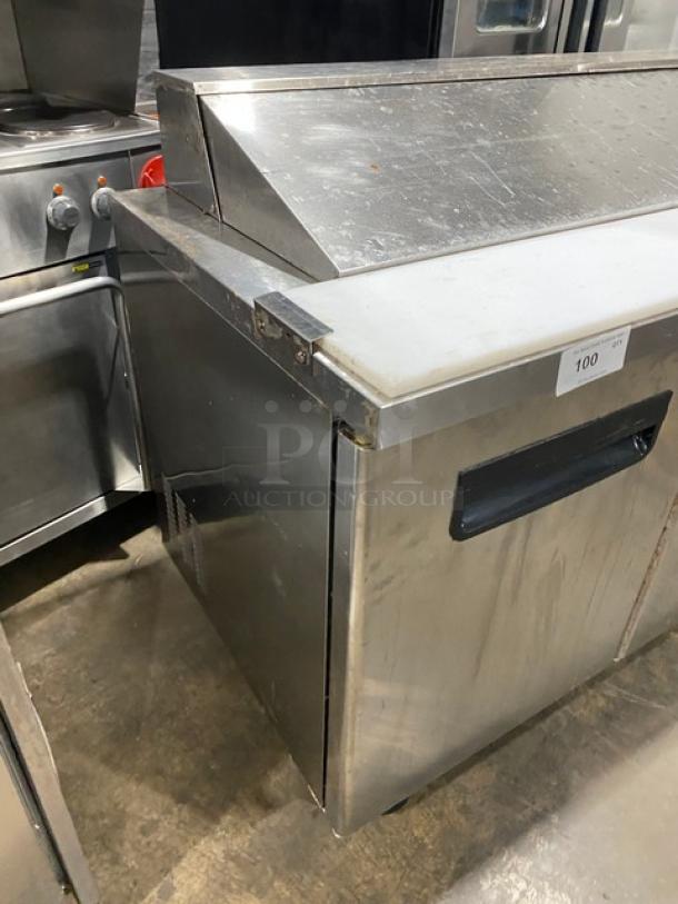 Blue Air 3-door stainless steel salad prep table, model BAPT72, with cutting board, wired rack, on casters, used condition.