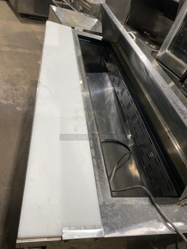 Blue Air BAPT72 stainless steel 3-door refrigerated prep table with cutting board, poly-coated wire rack, on casters.