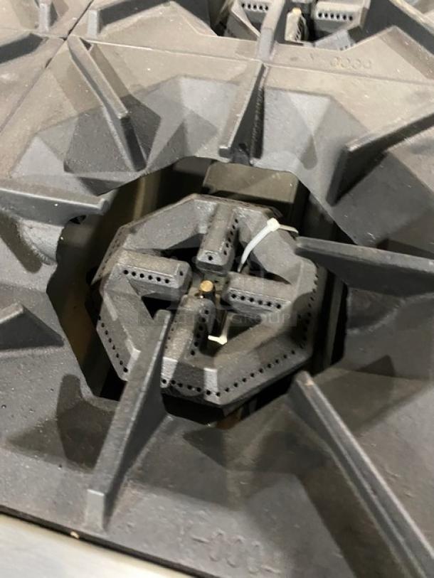CookRite commercial stove burner, part of a stainless steel natural gas flat-griddle and 4-burner range combo, new condition.