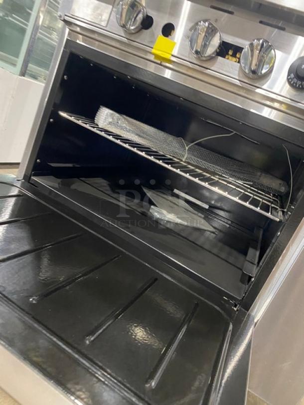 CookRite ATO12G4B stainless steel gas range oven combo, featuring an open wired rack inside and control dials on top.