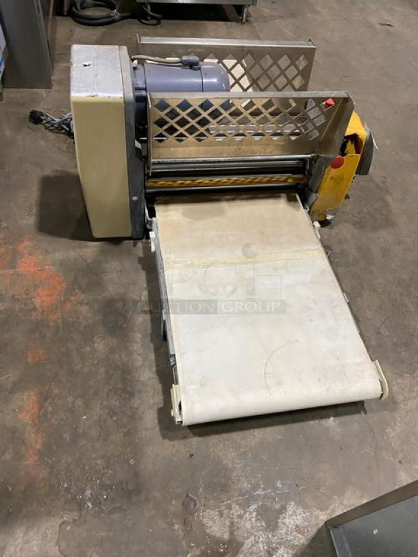 Anets commercial electric countertop conveyor-belt dough roller/sheeter, used condition, stainless steel frame, visible wear.