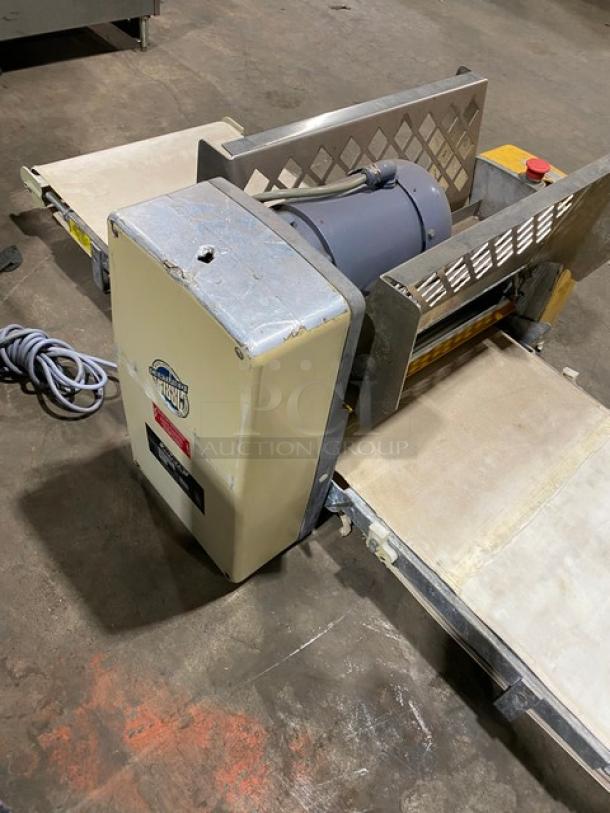 Anets commercial electric countertop conveyor-belt dough roller/sheeter. Features sturdy metal construction, visible wear.