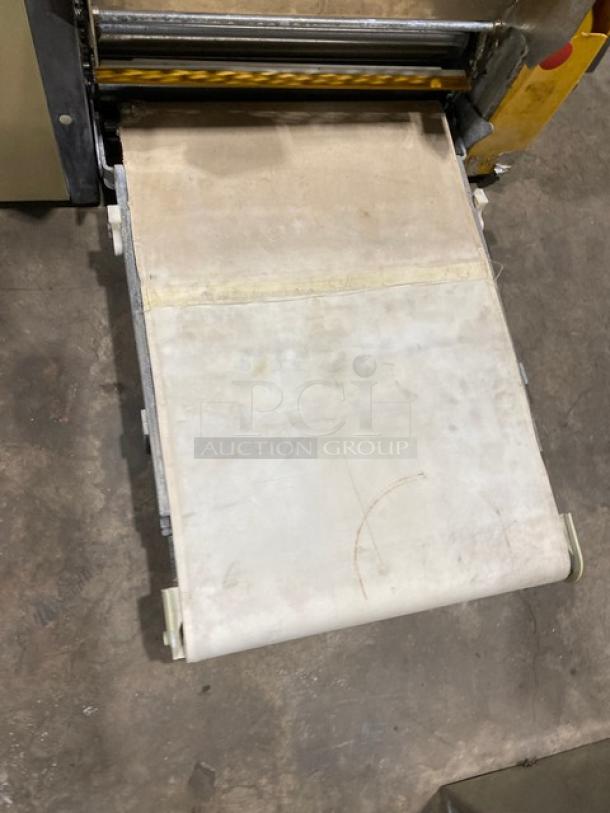 Anets commercial electric countertop conveyor-belt dough roller/sheeter. Visible wear on belt. Ideal for bakery use.