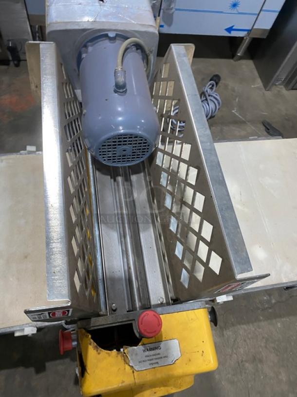 Anets commercial electric countertop conveyor-belt dough roller/sheeter, features stainless steel construction, visible safety guards, and control settings.