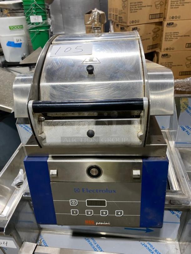 Electrolux HSPPA1 stainless steel panini press grill, electric-powered, countertop model on legs, 208V, good condition.