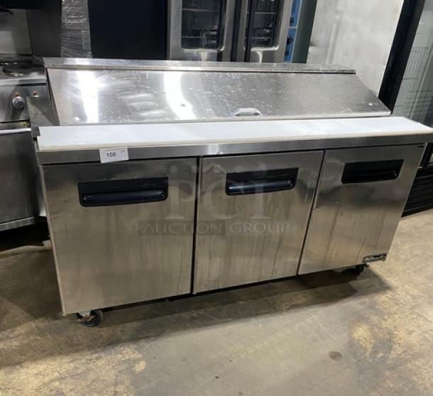 Blue Air BAPT72 3-door refrigerated salad/sandwich prep table in stainless steel. Includes cutting board, poly-coated rack, on casters.