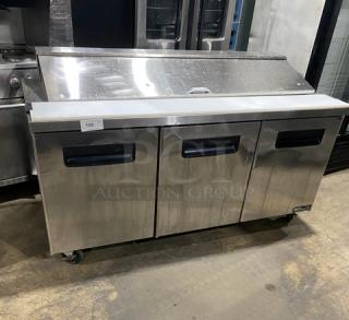 Blue Air BAPT72 3-door refrigerated salad/sandwich prep table in stainless steel. Includes cutting board, poly-coated rack, on casters.