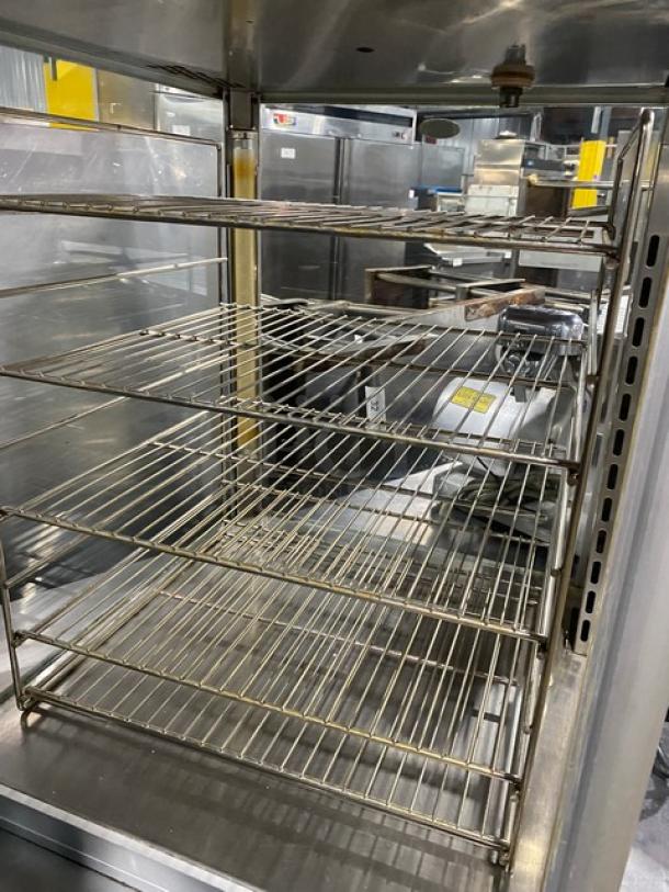 Hatco Flav-R-Savor FSDT-1X humidified hot-food display cabinet with 4-pan rack, stainless interior, model number visible.