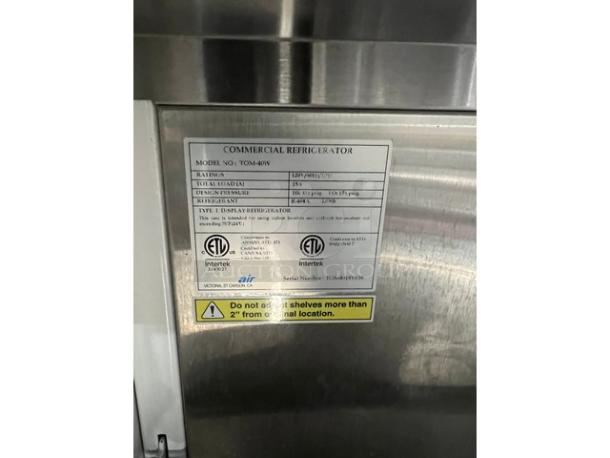 Turbo Air TOM-40W white refrigerated merchandiser with stainless steel interior, adjustable shelves, SN: TOM4018Y038, 120V.