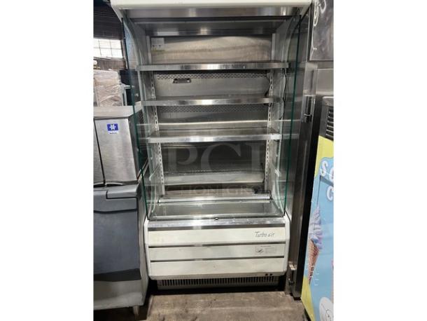 Turbo Air TOM-40W refrigerated open display case, white, stainless interior, adjustable shelves, model SN: TOM4018Y038.