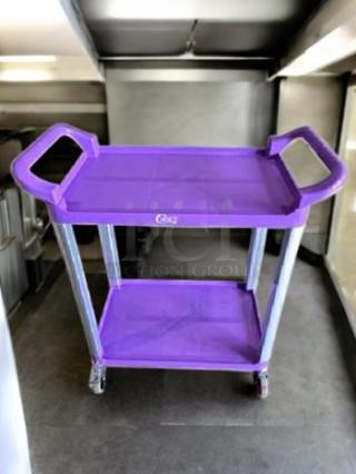 Brand new Choice Utility Cart, 2-shelf, purple, excellent condition. Features sturdy handles and casters for easy mobility.