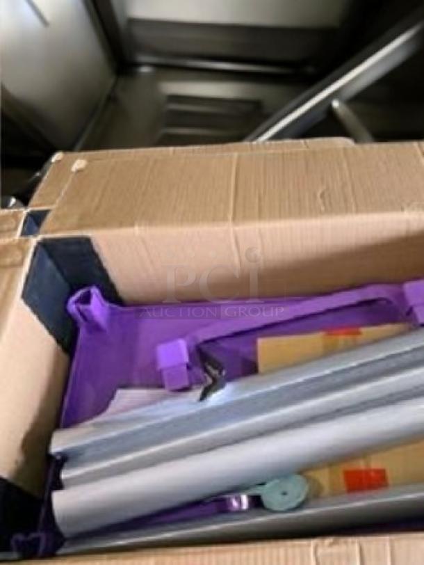 Brand new Choice Utility Cart, 2-shelf, purple, shown unassembled in box, excellent condition, includes metal and plastic components.
