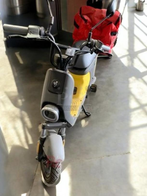 Segway Ninebot eMoped C80 in excellent condition, yellow and gray, with 750W motor. Fully tested and working.