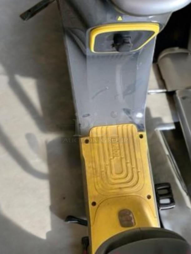 Segway Ninebot eMoped C80 electric scooter in excellent condition, gray and yellow body, visible Ninebot branding.