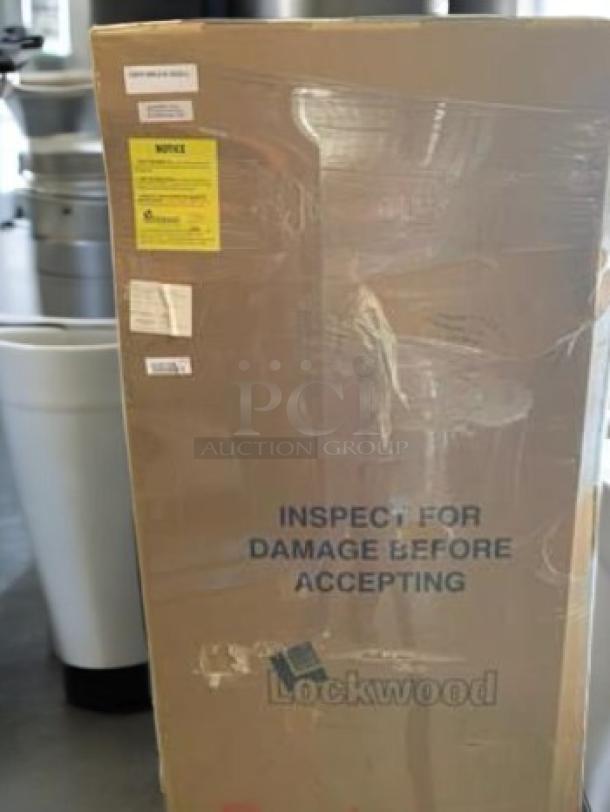 Brand new Lockwood full-height enclosed sheet pan rack in packaging, 20 pan capacity, stainless steel, excellent condition, with inspection warning.
