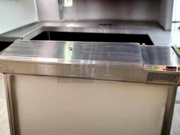 Turbo Air CTST-1800-13-N refrigerated countertop food prep rail in excellent condition, 71", 13 pan capacity, fully tested, stainless steel.