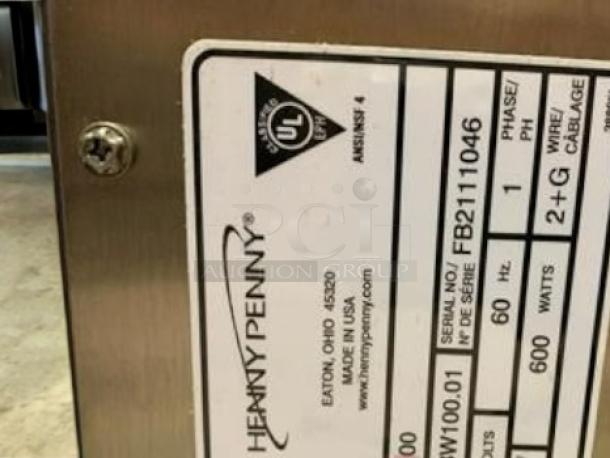 Henny Penny BW100 Bun Holding Cabinet label, showing model, 120V, UL certification, and serial number FB2111046. Made in USA.