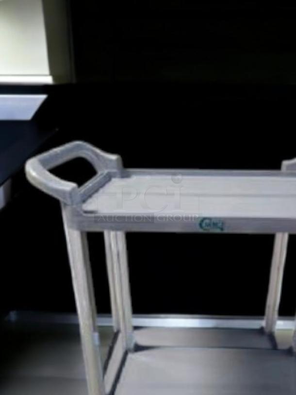Brand new Choice 2-Shelf Utility/Bus Cart in gray. Fully tested and working. Durable design with easy-grip handles.