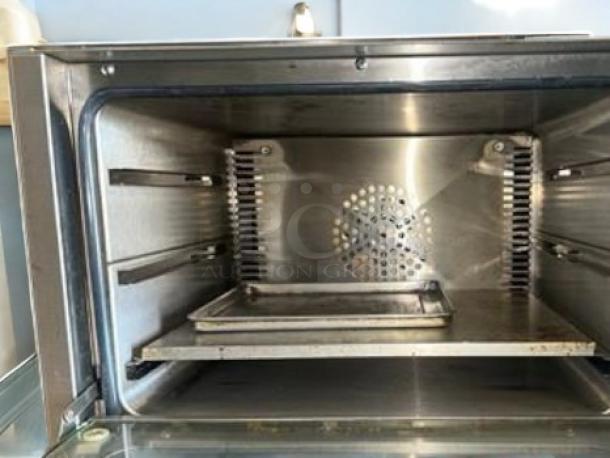 Adcraft COQ-1750W convection oven, excellent condition, features stainless interior, fully tested, 120V/1750W.