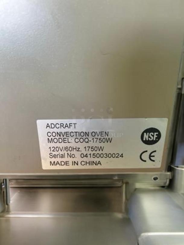 Adcraft COQ-1750W convection oven, excellent condition, 120V/1750W, fully tested. Label with model and serial number visible.