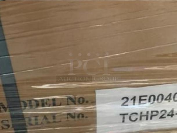 Brand new Therma-Tek TCHP24-4L countertop 4-burner hotplate, natural gas, model and serial numbers visible on packaging.