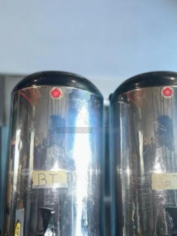 Commercial-grade stainless steel hot/cold beverage dispensers, excellent condition, fully tested, QTY 2, visible labels.