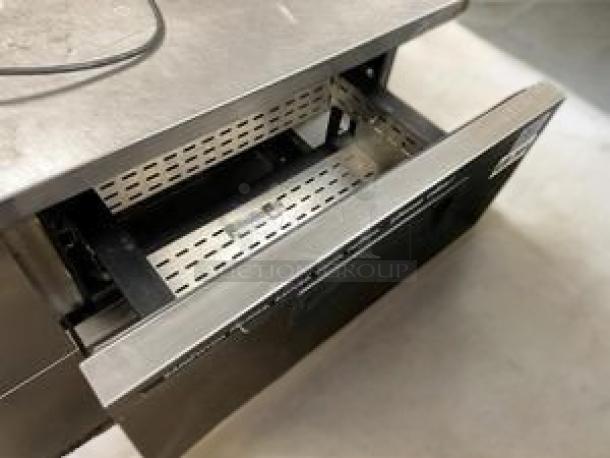 Stainless steel 2-drawer refrigerated chef base in excellent condition, showing open drawer. Fully tested and working, 115V AC.