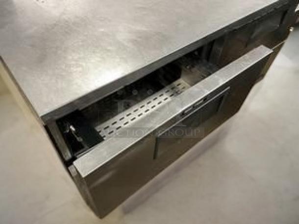 Stainless steel refrigerated chef base, 2-drawer model, excellent condition, 115V AC, fully tested and working.