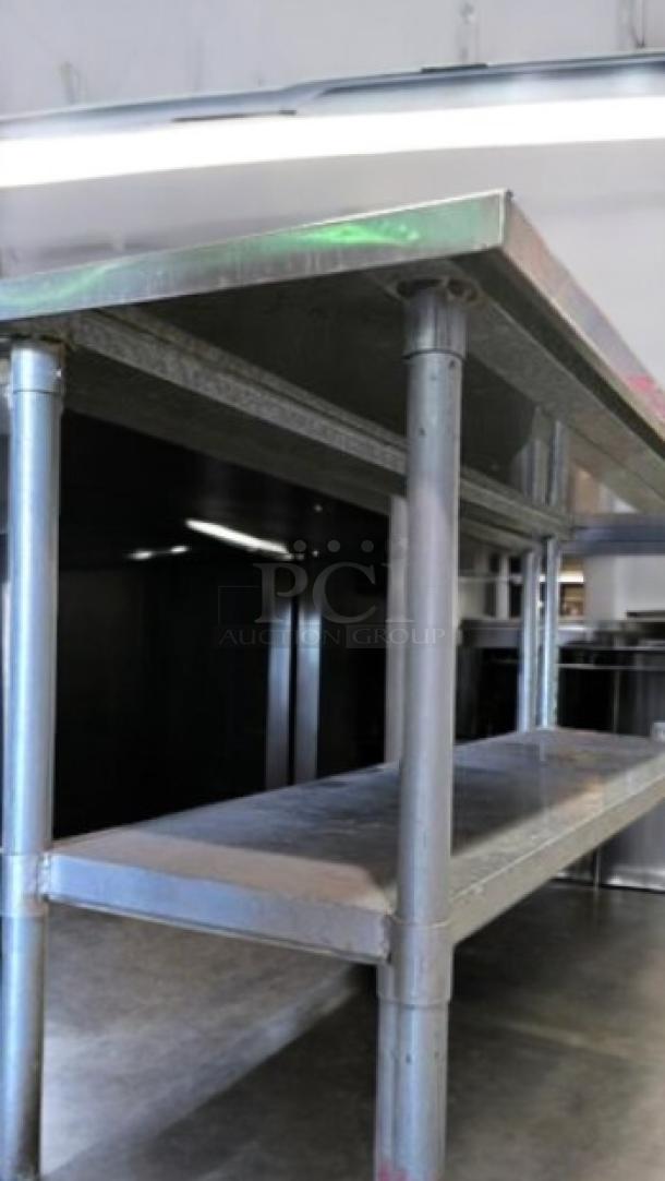 Commercial stainless steel work table with undershelf in excellent condition. Heavy-duty model, fully tested and working.