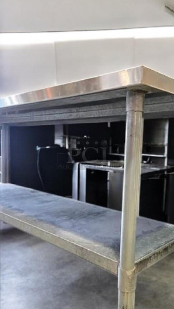 Stainless steel work table with undershelf, excellent condition, heavy-duty commercial model. Fully tested and working.