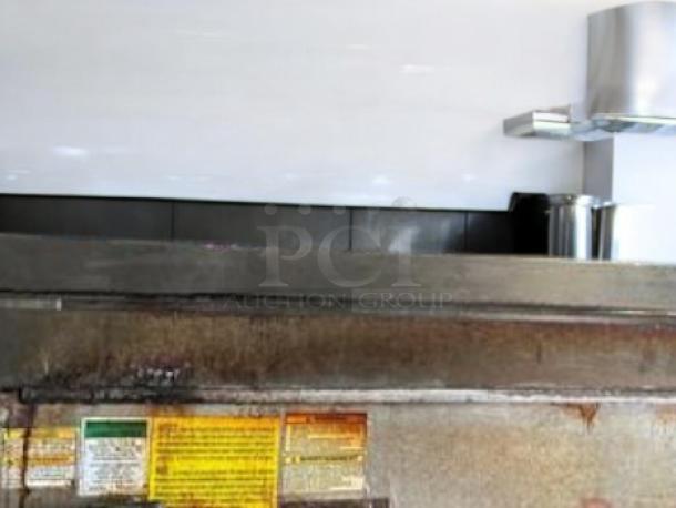 Vulcan VACB47 gas charbroiler, 47" wide, excellent condition, fully tested and working, durable steel construction, visible safety labels.
