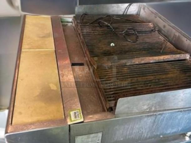 Vulcan VACB47 gas charbroiler, 47" wide, excellent condition, fully tested and working, visible wear on grates and surfaces.