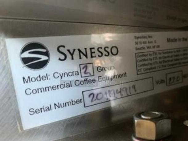 Synesso Cyncra 2-Group Espresso Machine label showing model, serial number, and 220V specification.