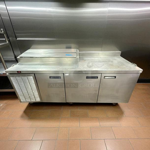 Delfield 3 Door Pizza Prep Table, excellent condition, stainless steel, 115v, tested and working, ideal for kitchen use.