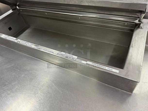 Delfield 3 Door Pizza Prep Table in excellent condition, stainless steel, 115v, with labeled ingredient compartments.